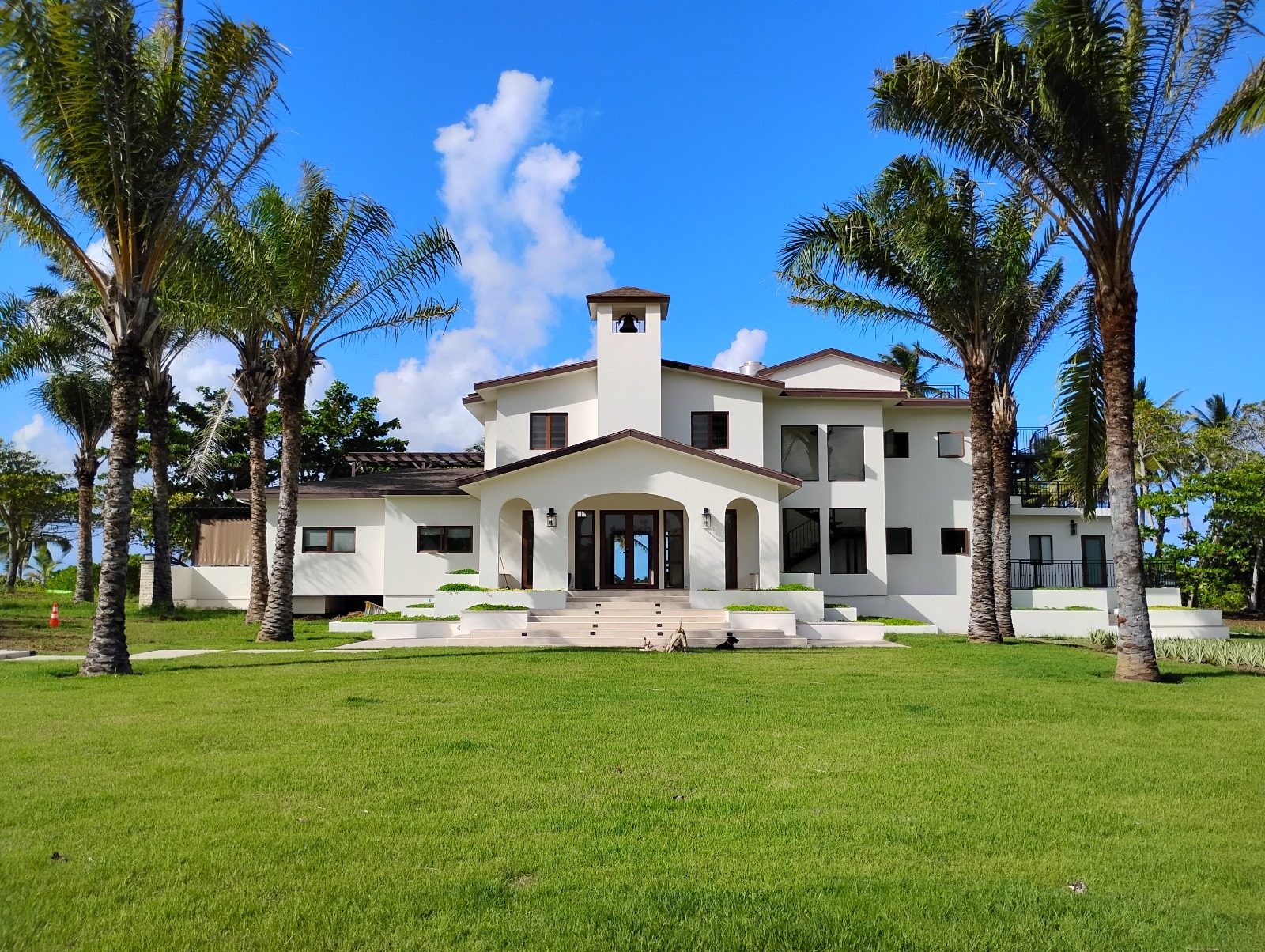 The main villa among palms on the Swamis PR estate